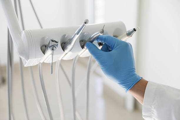 Professional Tooth Extraction technician working in Columbia, MO